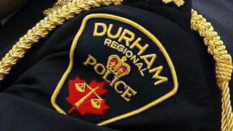 A Durham Regional Police Service logo is seen on a police uniform.