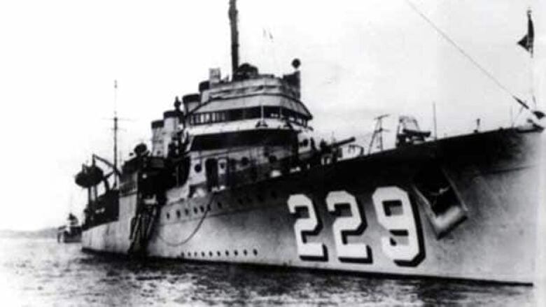 A US. navy ship with the number 229 on the side.