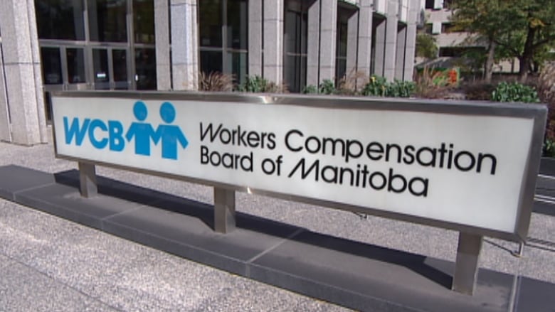 A sign outside a building reads 'Workers Compensation Board of Manitoba.'