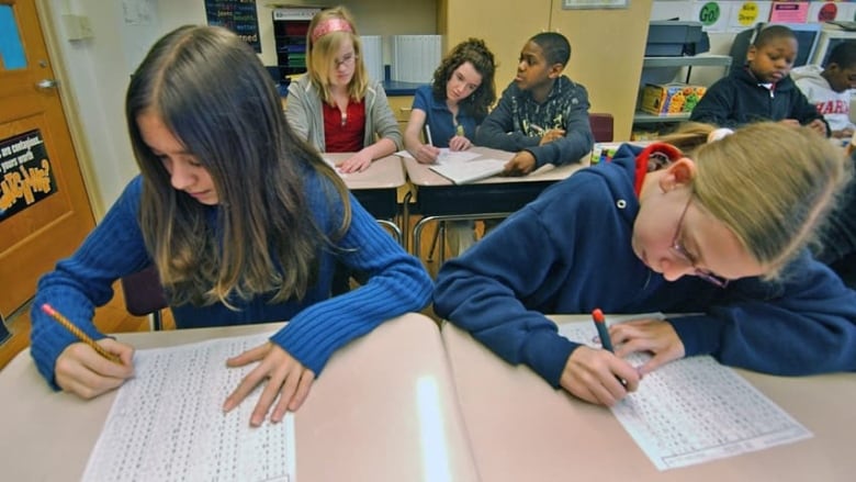 Students doing classwork in a classroom