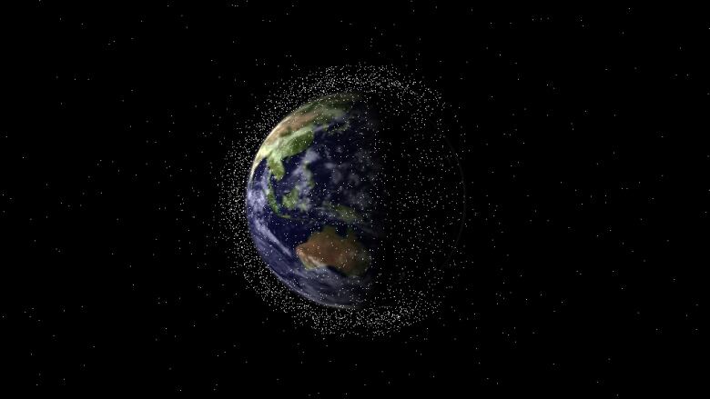 An image of the Earth from afar highlights lots of little dots circling the planet.