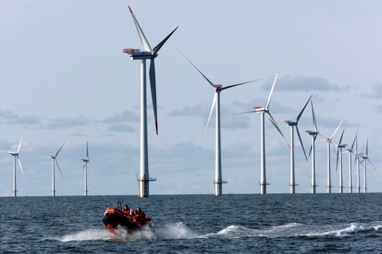 Wind turbines in a body of water.