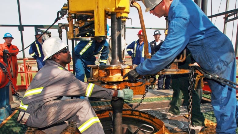 Oilpatch workers on the job.