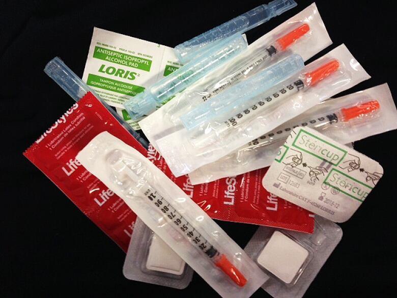 The contents of a kit distributed by Montreal Public Health in pharmacies and community organizations: syringes, sterilized water, mixing cups, condoms and alcohol swabs.