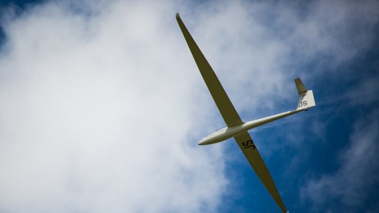 A glider is seen from below.