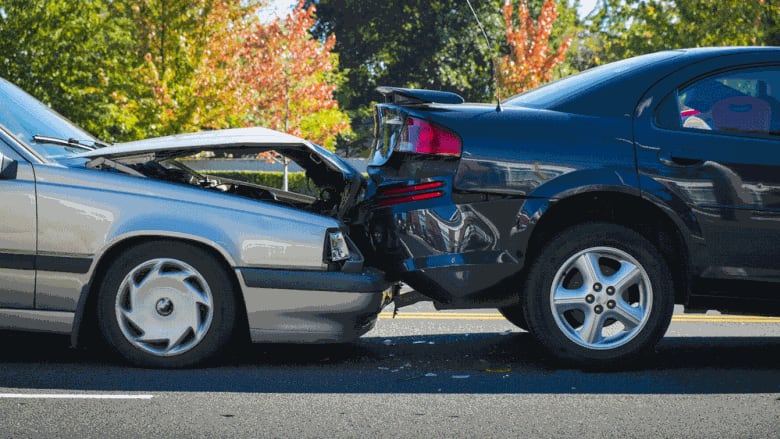 Minor accident with one car rear-ending another.