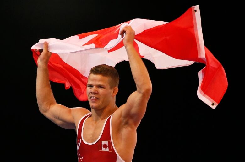 Canada's David Tremblay celebrates winning gold in the men's 61 kg freestyle wrestling event at the Commonwealth Games.  