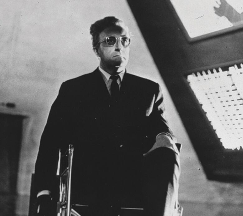 Peter Sellers as the title character in the 1964 satirical film Dr. Strangelove.