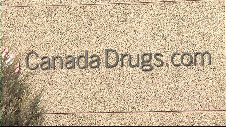 Letters on the outside of a beige building read Canada Drugs dot com.