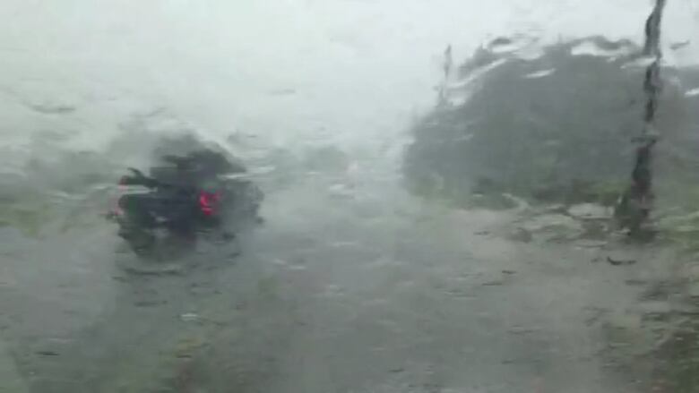 A CBC video-journalist captured this image of heavy rain falling in Belle River on Tuesday afternoon. Environment Canada has issued a severe thunderstorm warning for Windsor, Leamington, Essex County, Chatham-Kent and Rondeau Park.