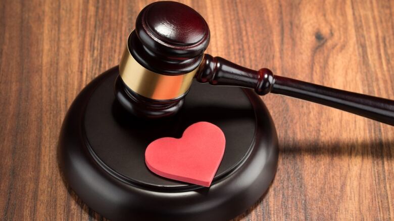 Gavel with a heart on it.