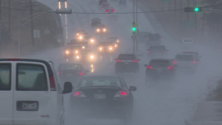 Vehicles driving in the rain.