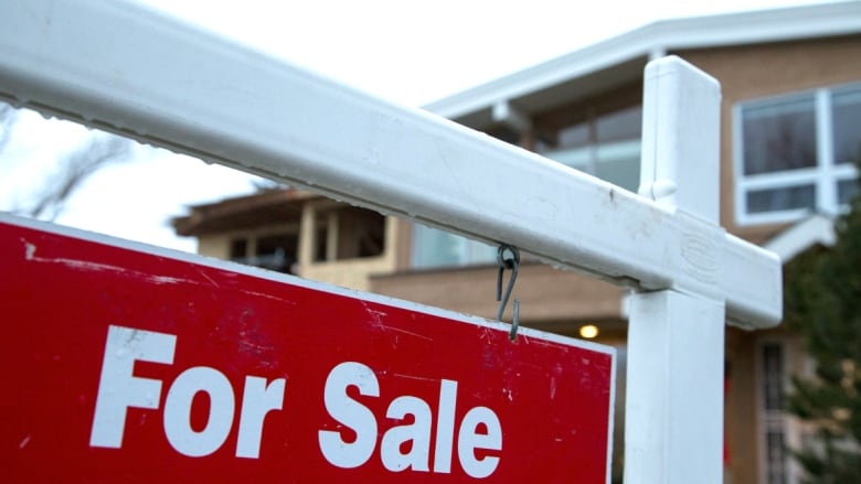 Close up of a home for sale sign.