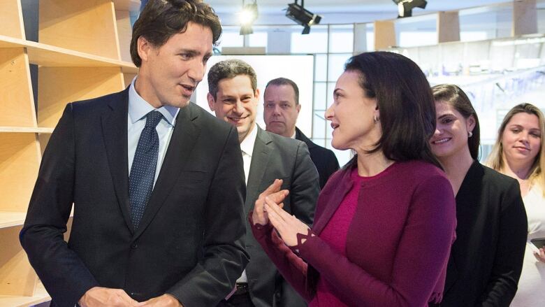 Prime Minister Justin Trudeau chats with Sheryl Sandberg, Facebook chief operating officer during a bilateral meeting in Davos, Switzerland on Wednesday, Jan. 20, 2016. Trudeau is attending the the World Economic Forum where political, business and social leaders gather to discuss world agendas. 