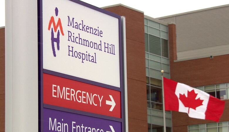 A sign that says Mackenzie Richmond Hill Hospital, and Emergency