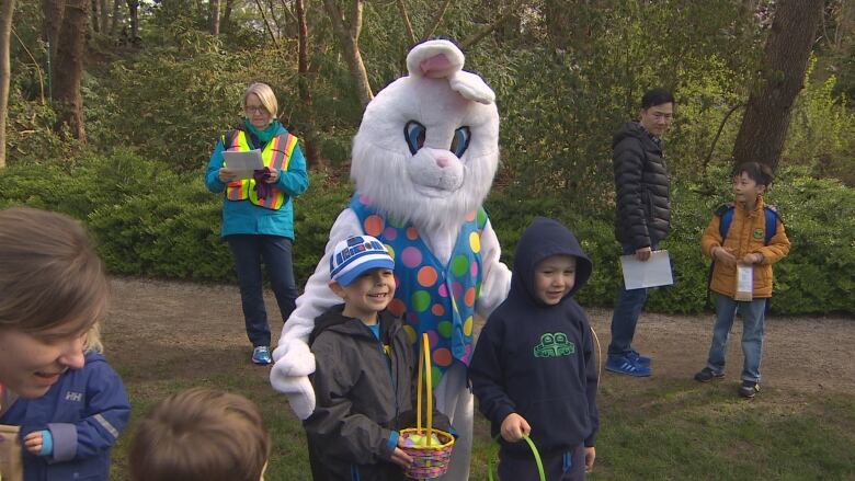 Kids pose with the Easter Bunny.