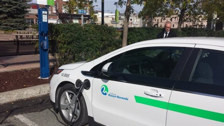 parked electric car at a charging station