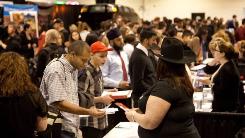 Crowds of people at hiring fair