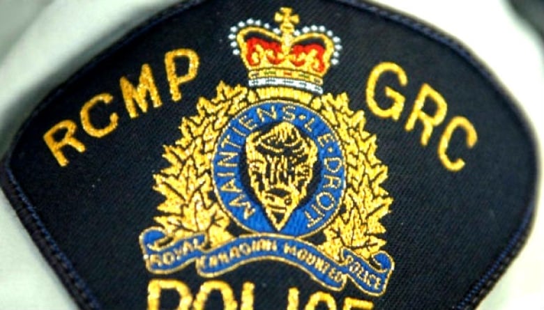 A close-up picture of an RCMP badge.