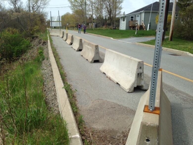 A road with barriers on the edge of it