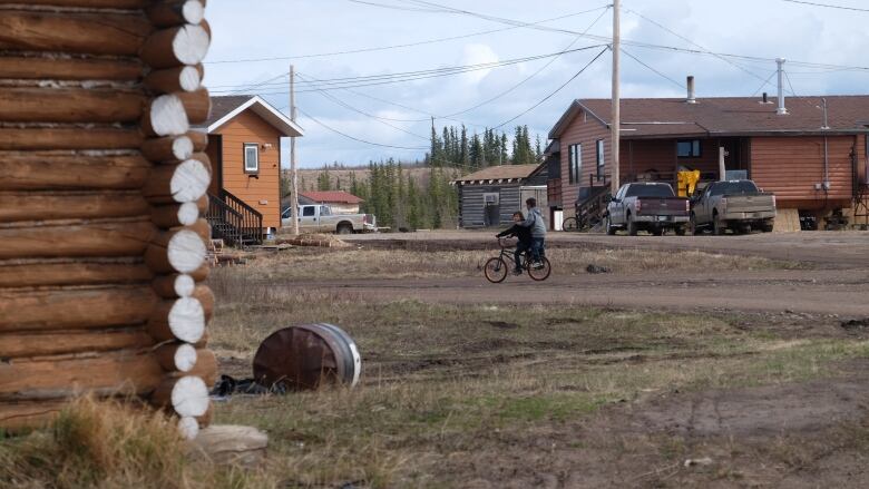 Kids ride on their bikes.