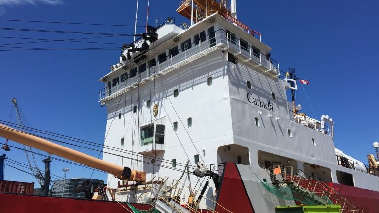 A red and white ship. 