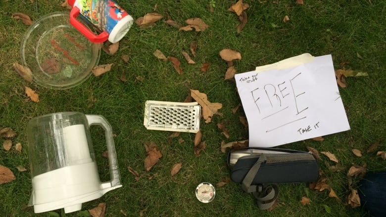 items on the ground with free sign