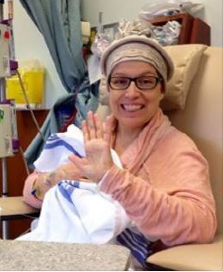 Woman in hospital bed smiling