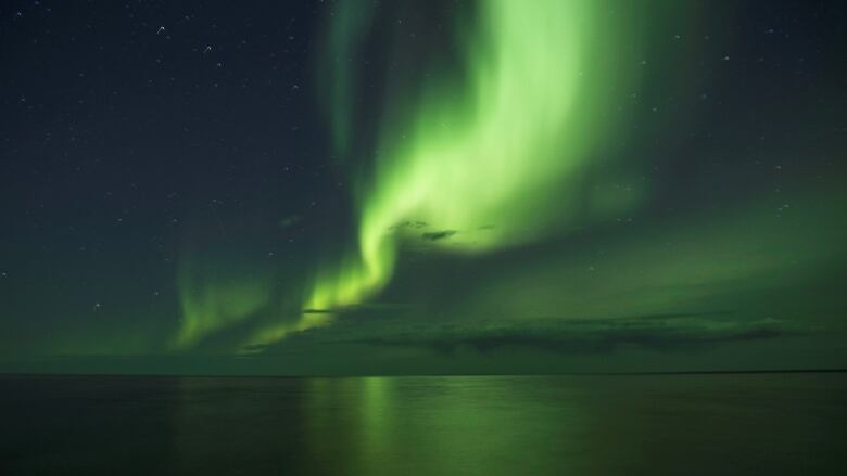 The aurora borealis appears over Great Bear Lake.