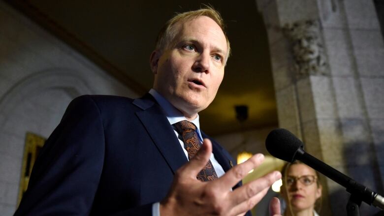 NDP MP Peter Julian speaks to reporters as he announces that he will step down as NDP House leader, on Parliament Hill, Wednesday, Oct. 19, 2016 in Ottawa.