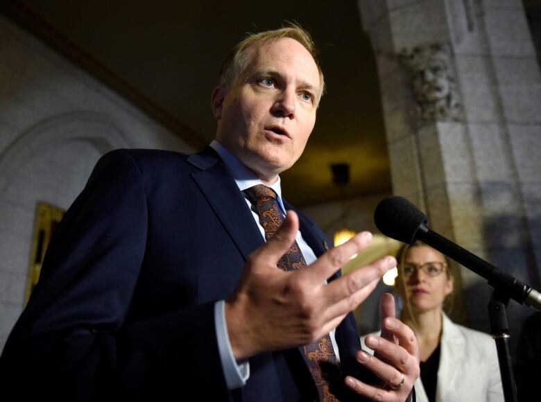 NDP MP Peter Julian speaks to reporters as he announces that he will step down as NDP House leader, on Parliament Hill, Wednesday, Oct. 19, 2016 in Ottawa.