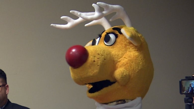 A giant, red-nosed reindeer mascot costume.