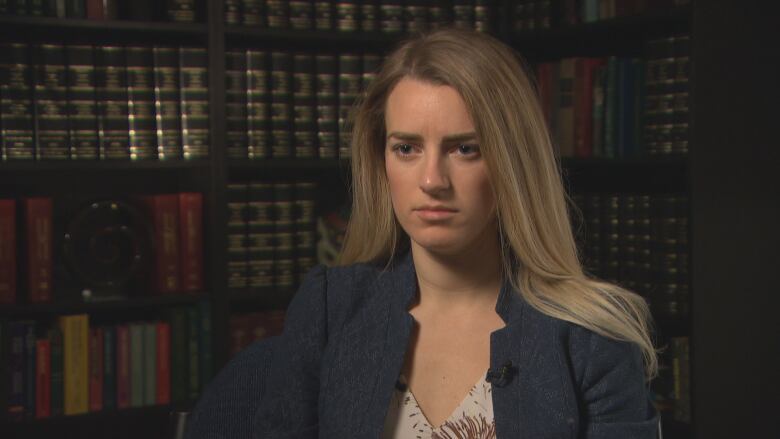 A portrait shot of a woman a blazer 