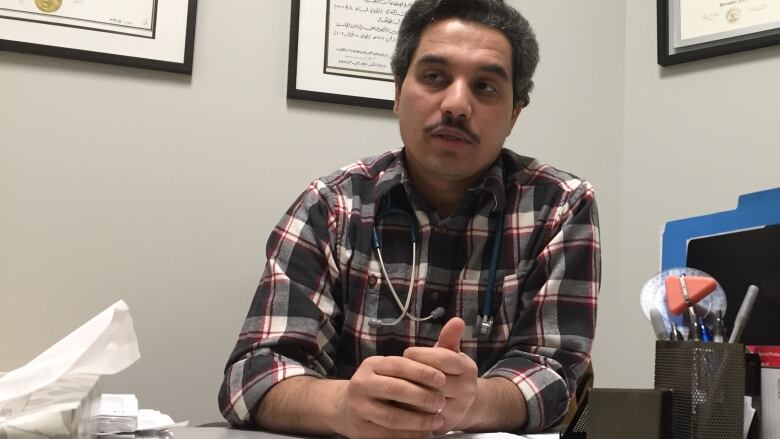 Dr. Ghassan Al-Naami, photographed at his desk in early 2017 while working in Fort McMurray, Alta. 