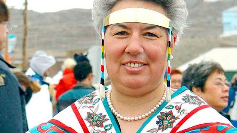 A woman in a traditional Inuk headdress