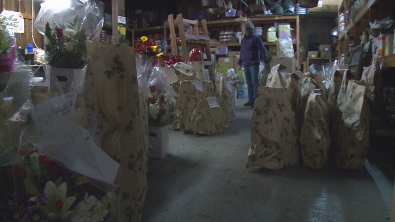 Gardening supplies are spread across a floor.