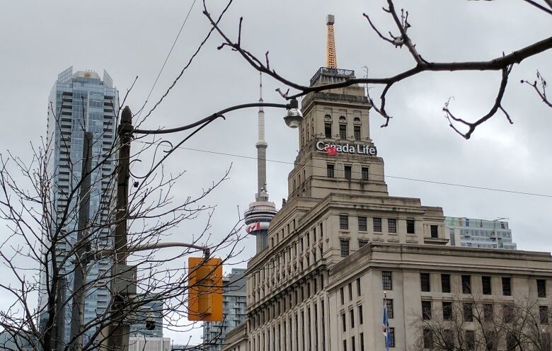 A downtown scene with a historic-looking building in the foreground.