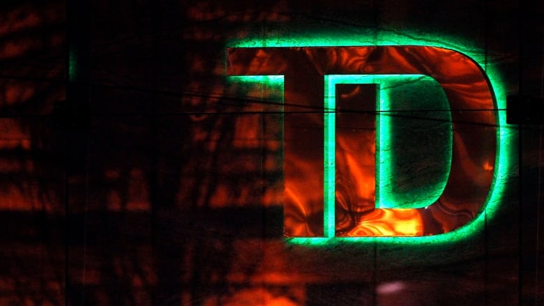 The TD bank logo glows with a green hue.