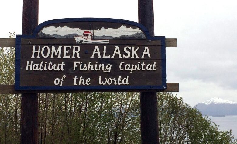 A sign that says Homer, Alaska 