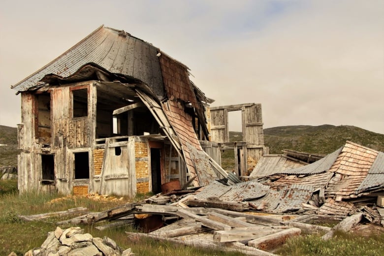 An abandoned home sits on the land.