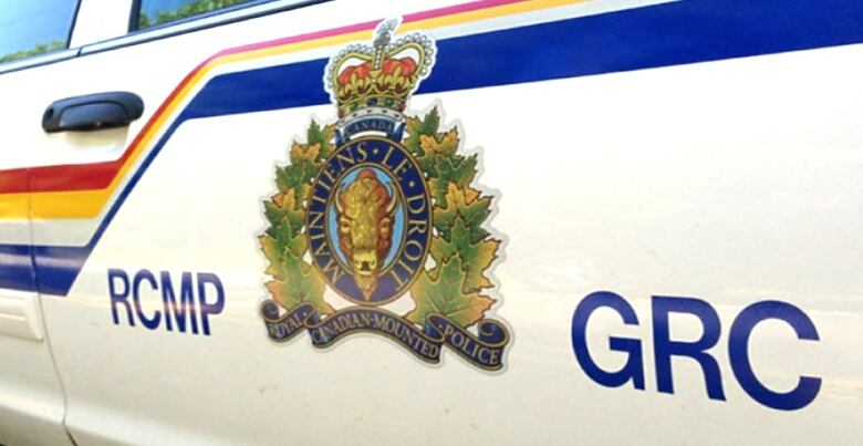 Image of RCMP logo on the side of a RCMP vehicle.