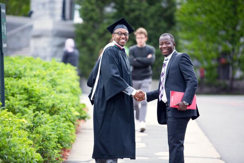 Two people shaking hands.