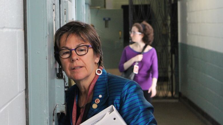 Senator Kim Pate listens to an inmate being held in segregation during a visit to Ontario's Millhaven Institute on May 16, 2017.