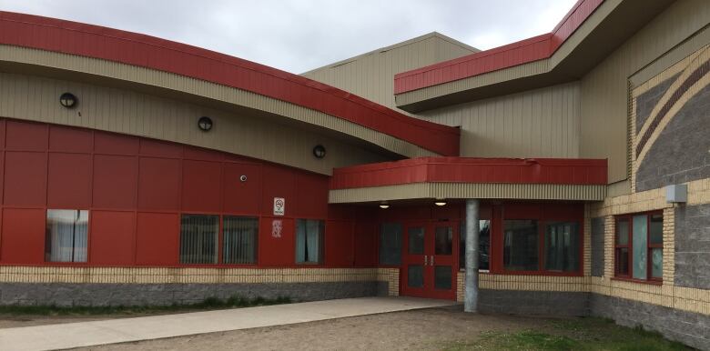 A red and beige building.