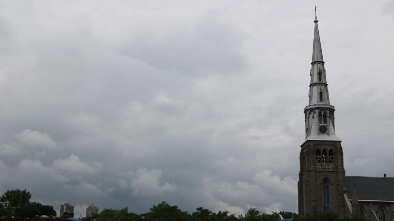 Clouds loom over the Church of Saint-Pierre-Aptre in downtown Montreal.