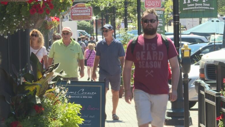 People walking down a Charlottetown street.