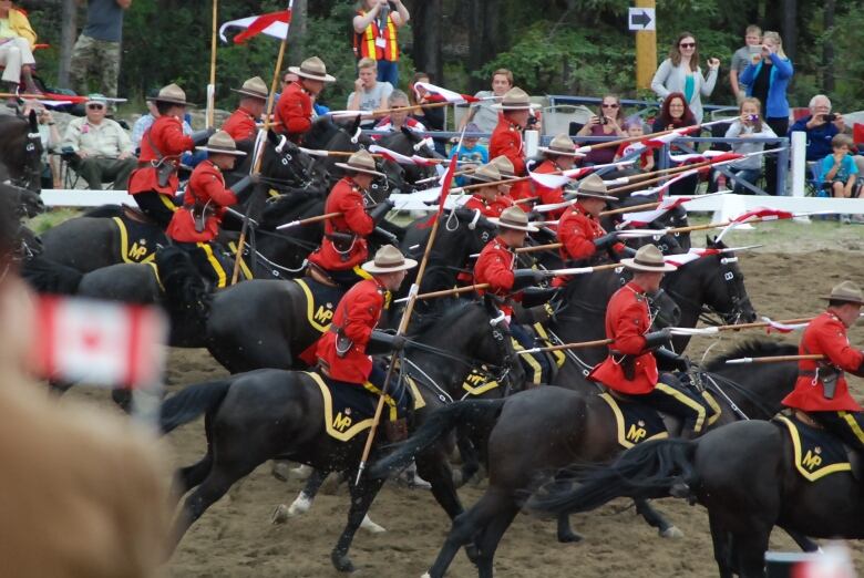 Charge! Officers dip their lances as 32 the black Hanoverian horses rush forward.