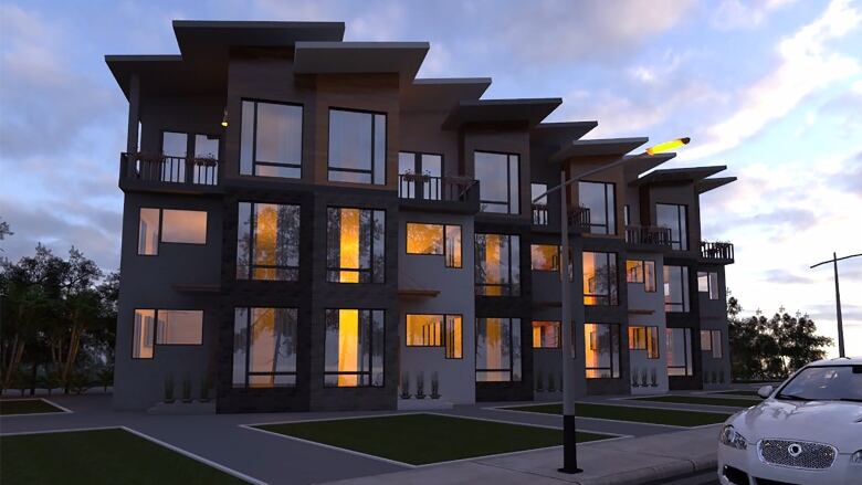 A newly built three-storey row housing with long windows lines a tidy Edmonton street. 