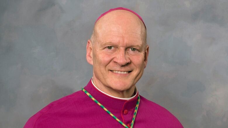 Portrait of religious man in pink.