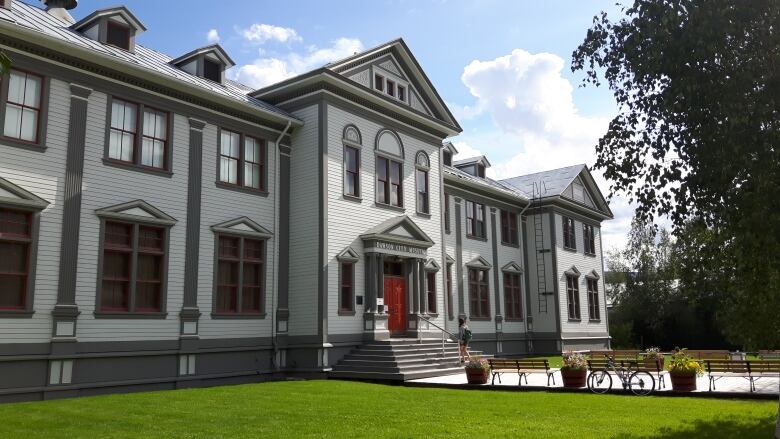 A large century-old building is seen from the outside.